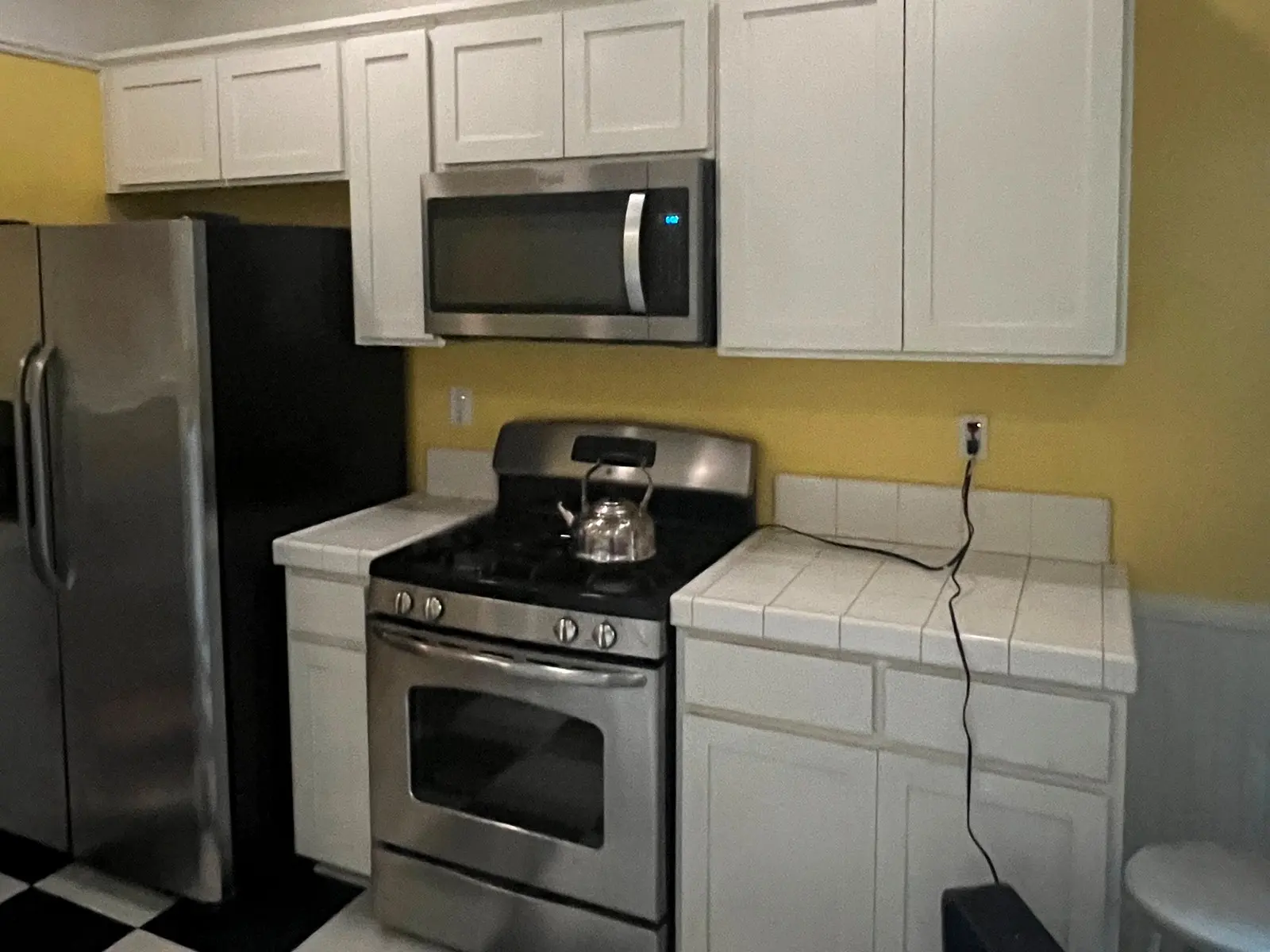 Gray-to-Navy Kitchen Cabinets before